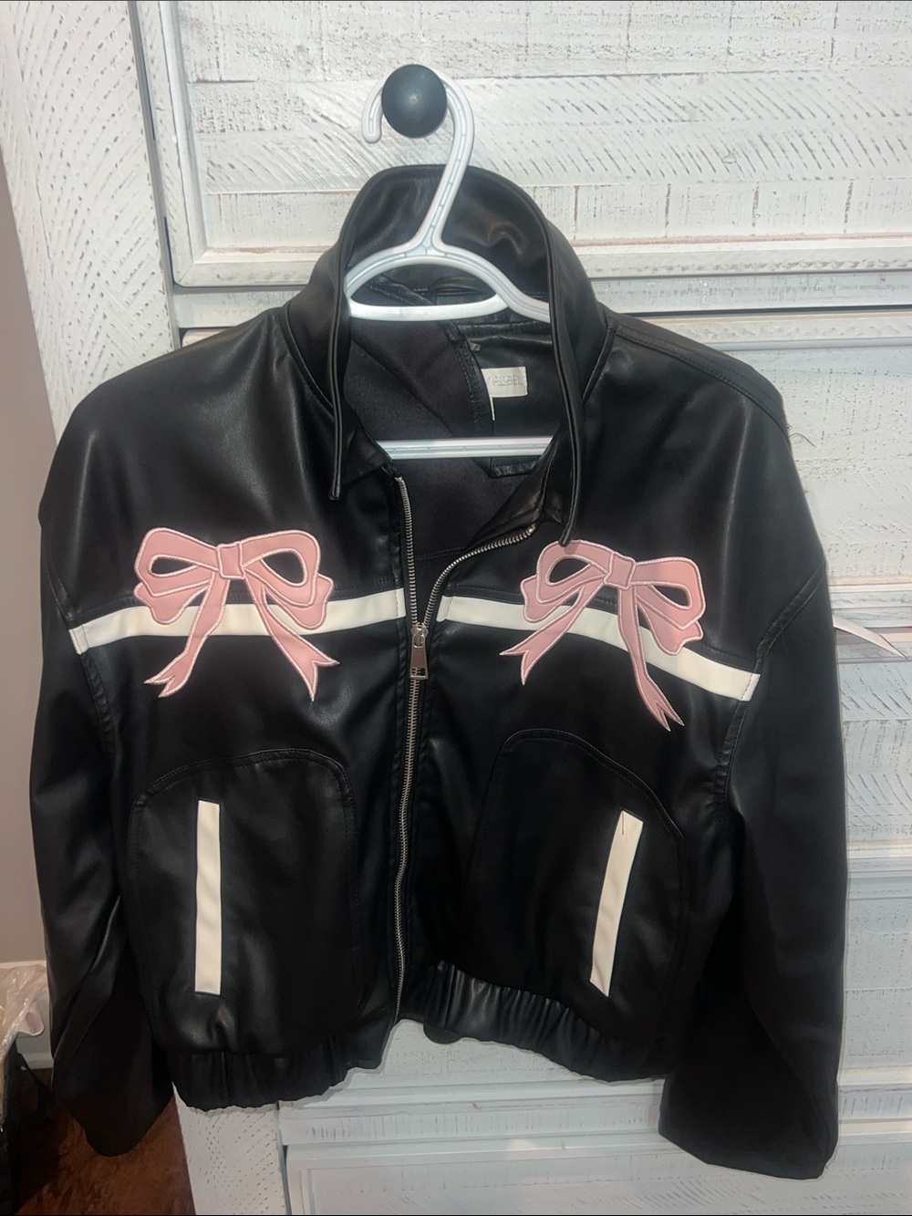 Project Rebel Black Faux Leather Jacket with Pink Bow Accents